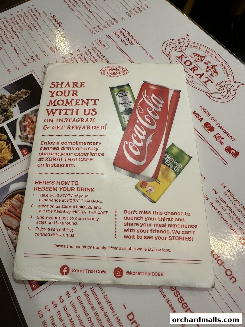A promotional flyer for Korat Thai Cafe offering a free drink for Instagram shares.