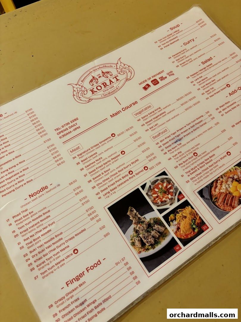 A menu from Korat Thai Cafe featuring main courses, noodles, finger food, soups, curries, and salads.