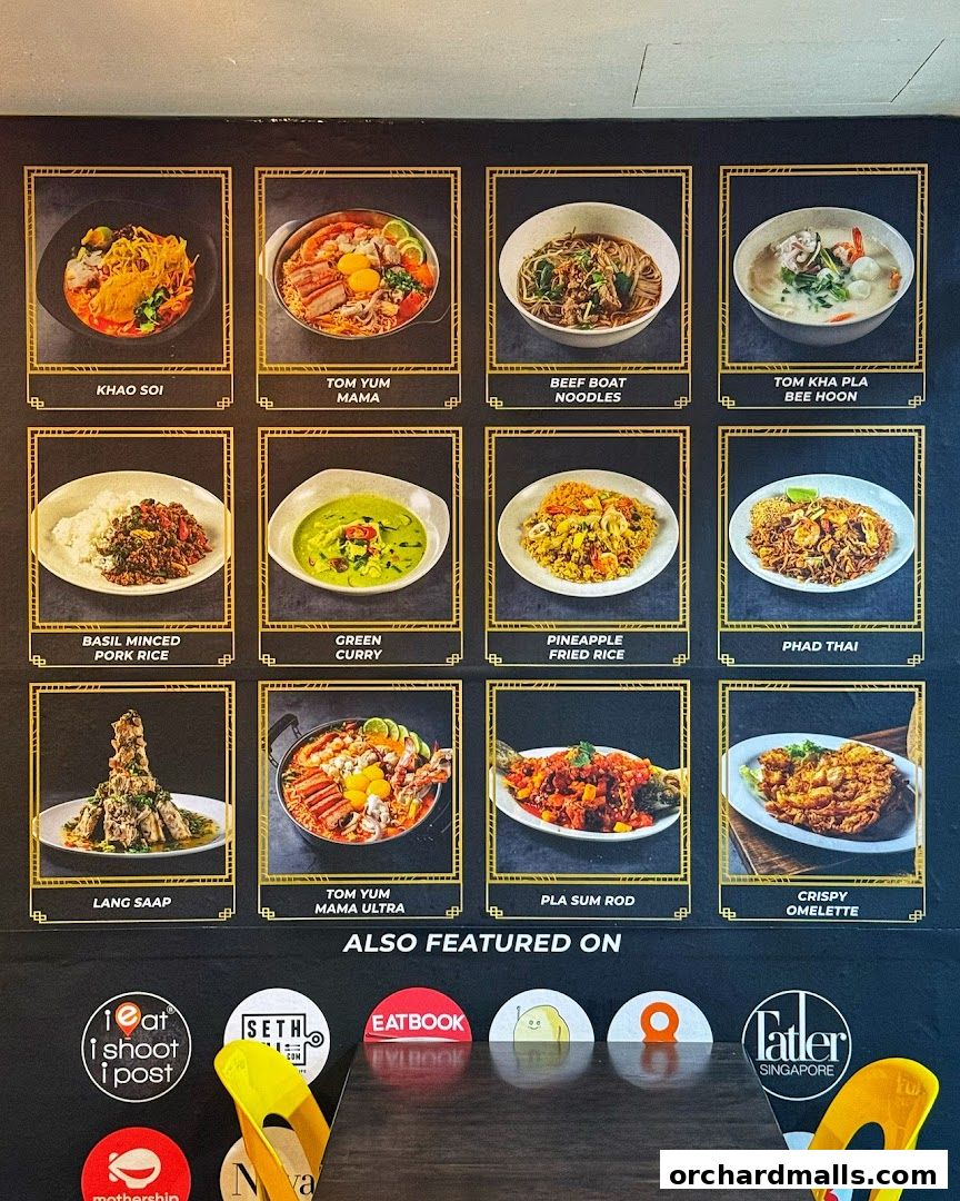A menu board showcasing various Thai dishes with enticing images and names.