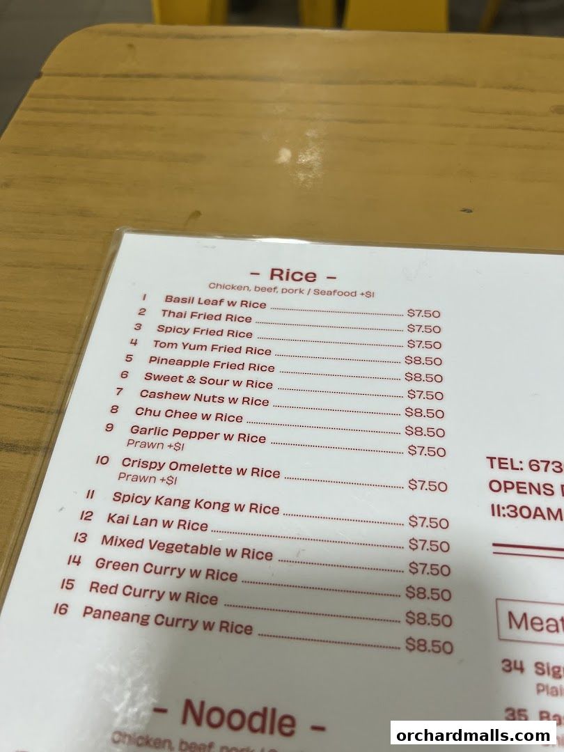 A menu from Korat Thai Cafe featuring rice dishes and contact information.