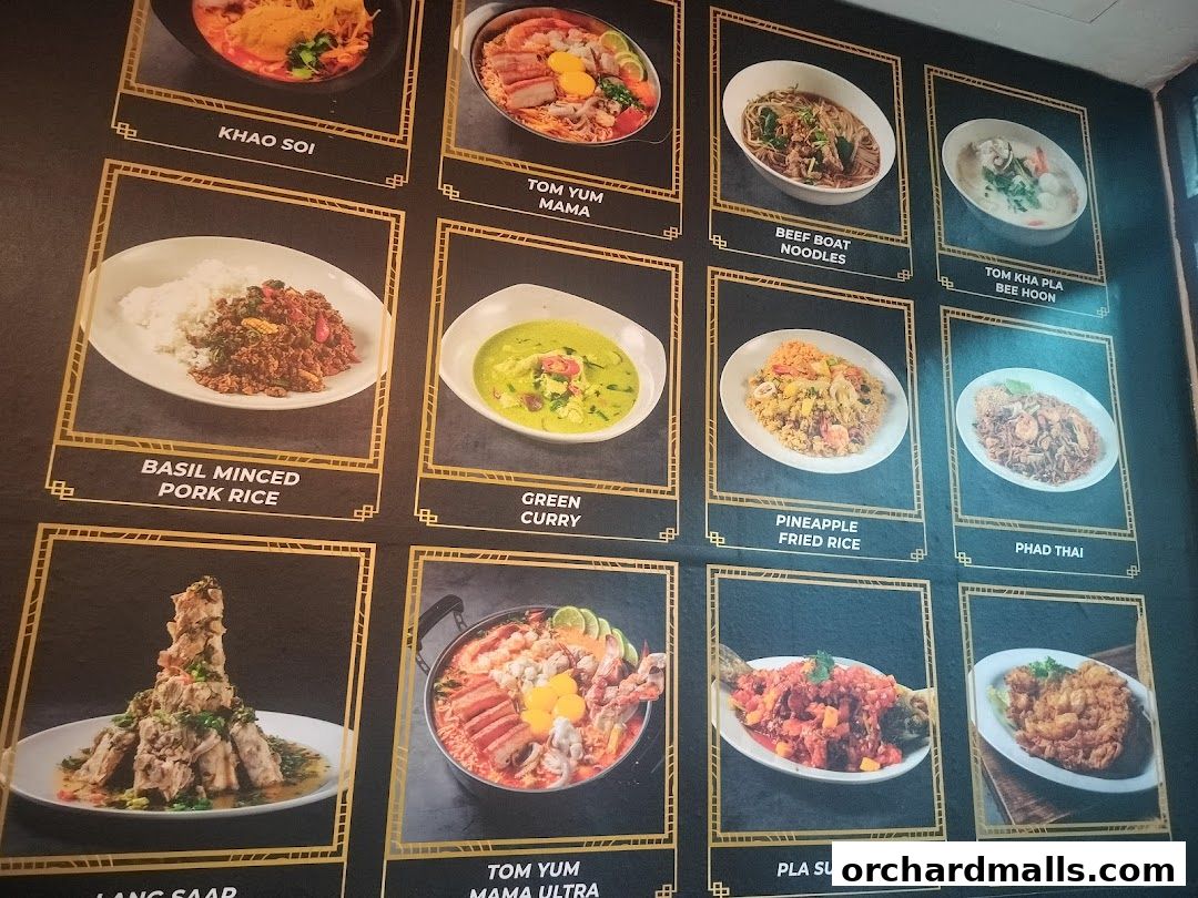 A menu board displaying various Thai dishes with appetizing images and names.
