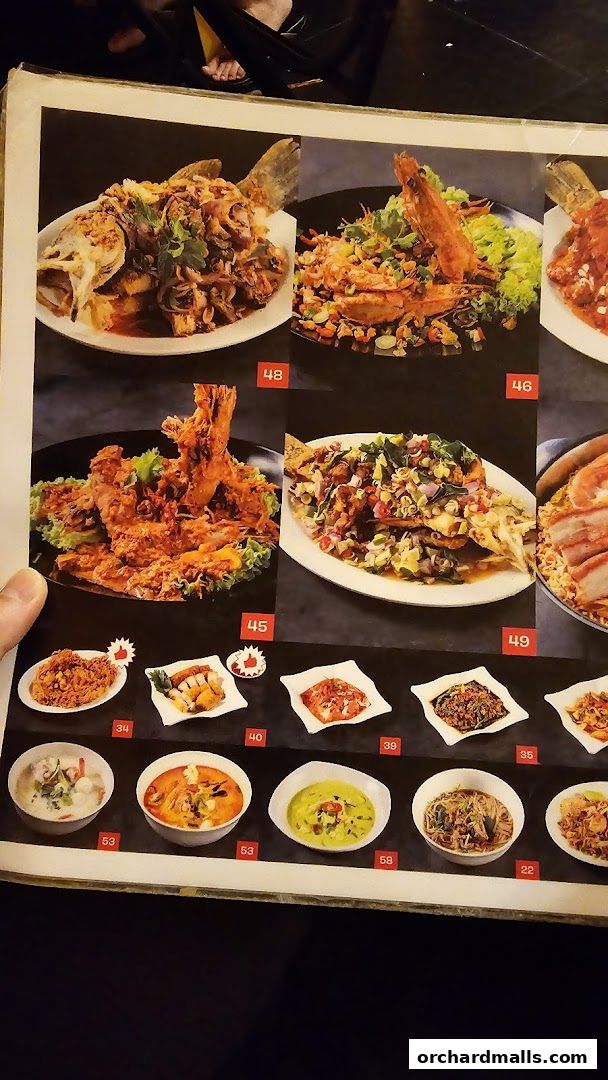 A menu page from Korat Thai Cafe showcasing various Thai dishes with their corresponding numbers.