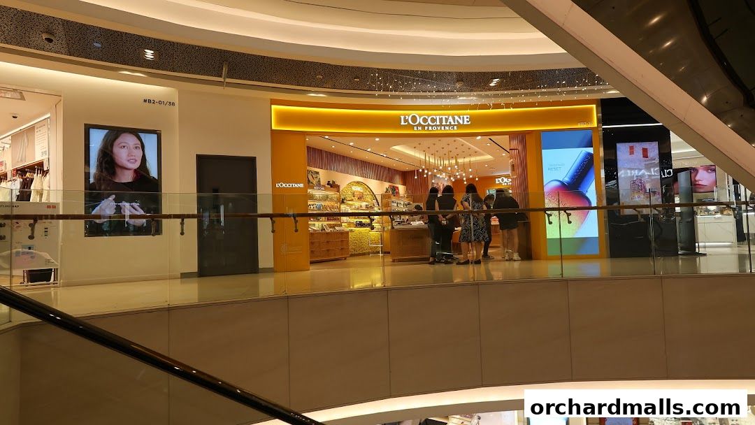 The L'Occitane store entrance with products displayed and customers browsing.