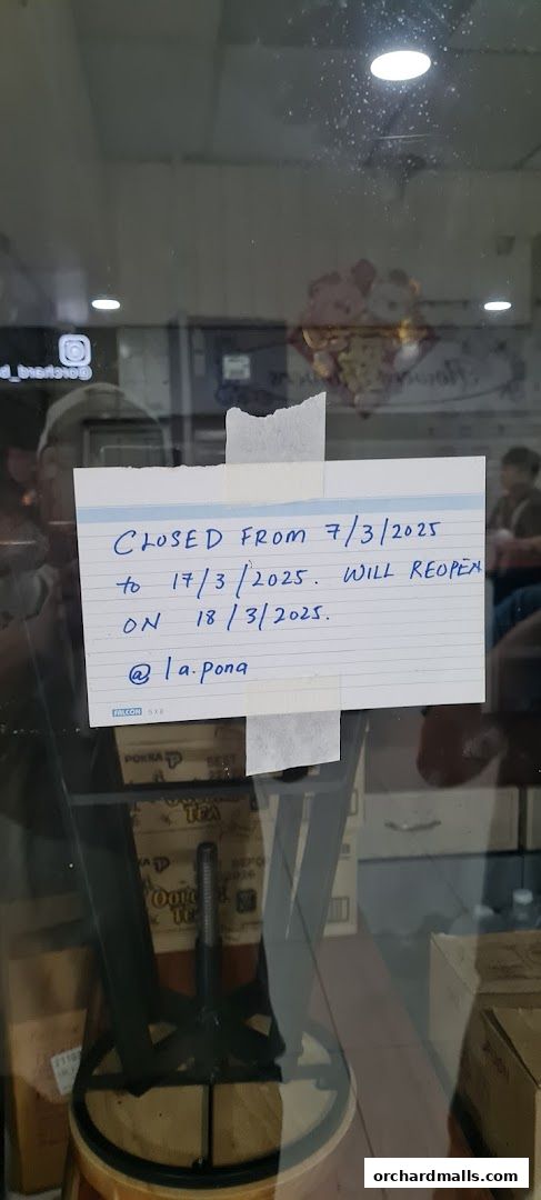 A handwritten sign on a glass door indicates the shop is closed for renovations.