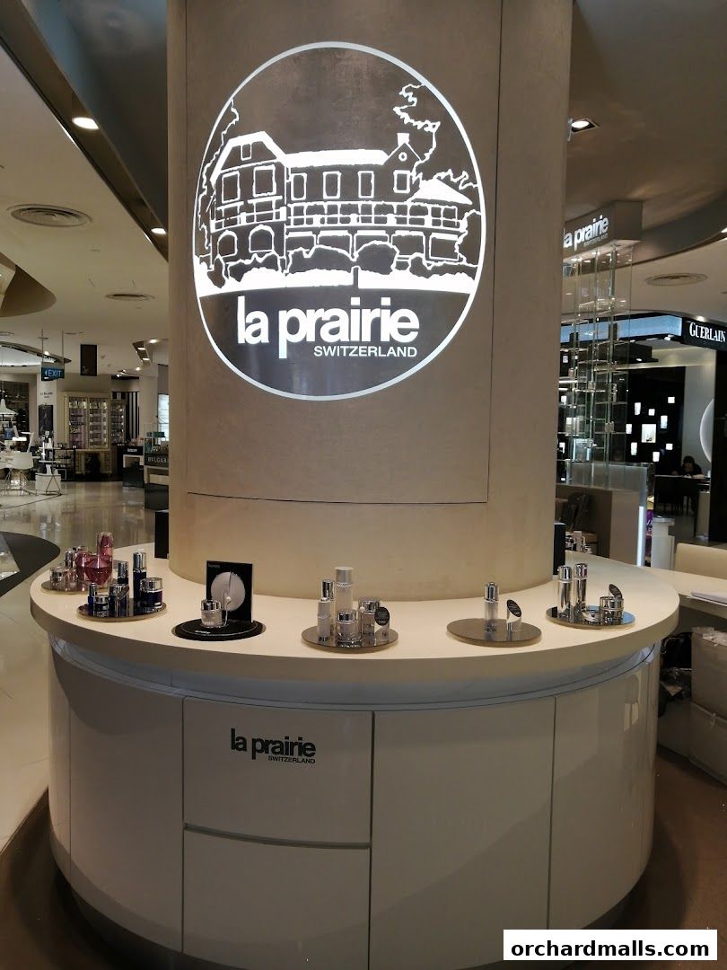 La Prairie Switzerland counter displaying luxury skincare products in a retail setting.