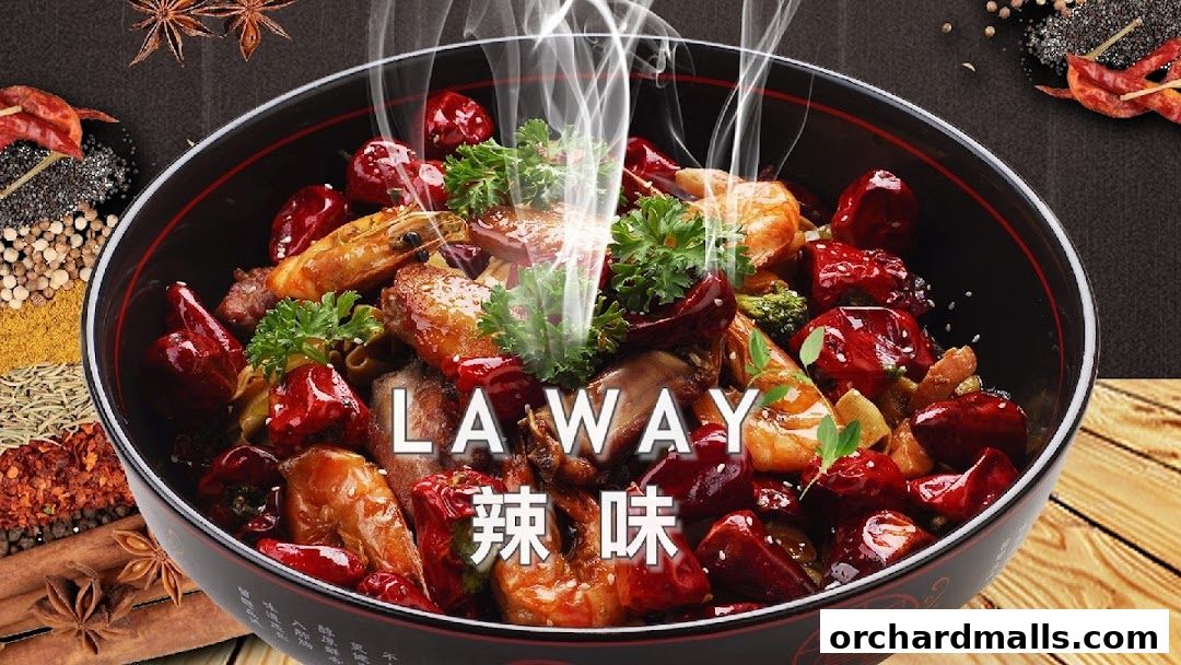 A steaming bowl of Mala Hotpot with shrimp, chicken, and dried chilies, surrounded by spices.
