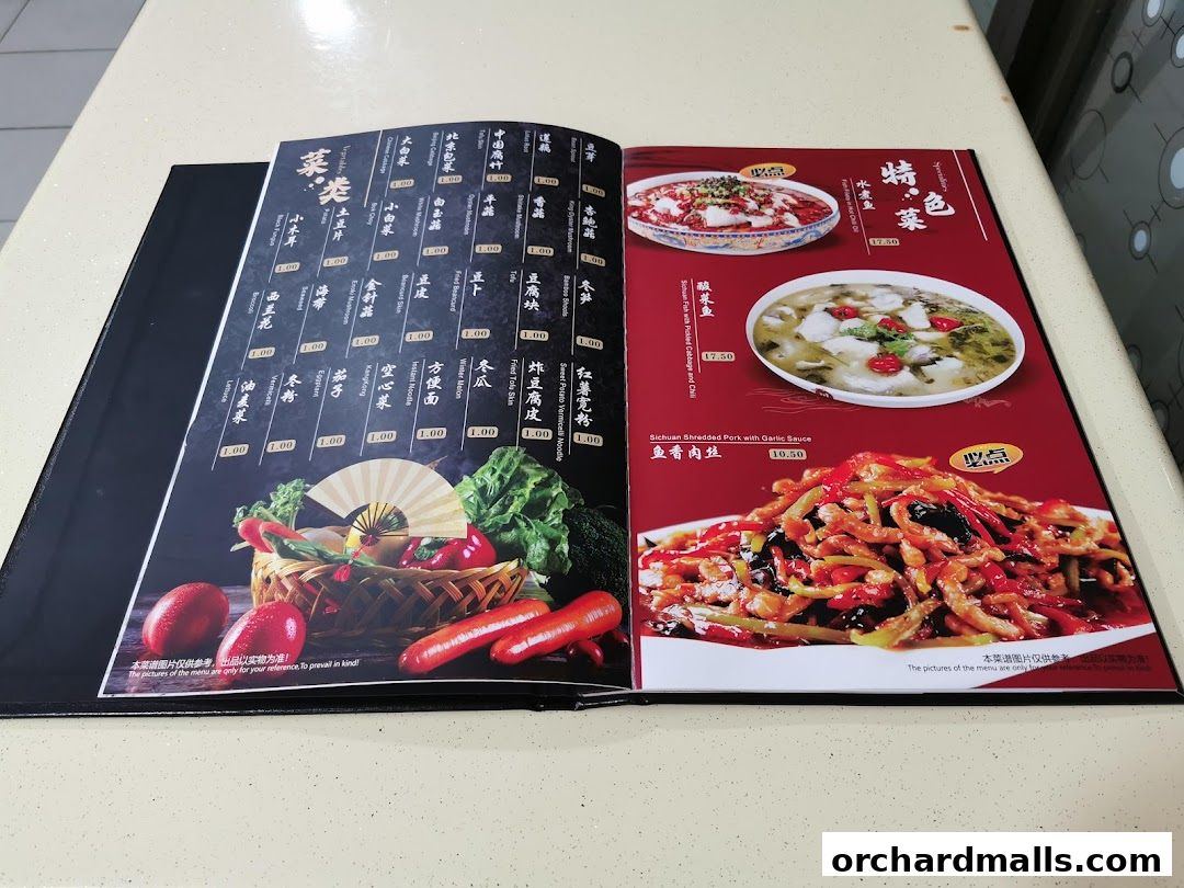 An open menu from La Way - Orchard 辣味 - 乌节路店, showcasing various dishes with images and prices.