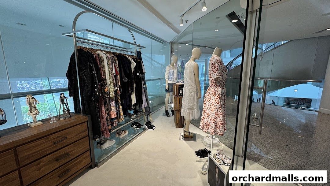 Interior view of a Lafont clothing store with mannequins and apparel on display.