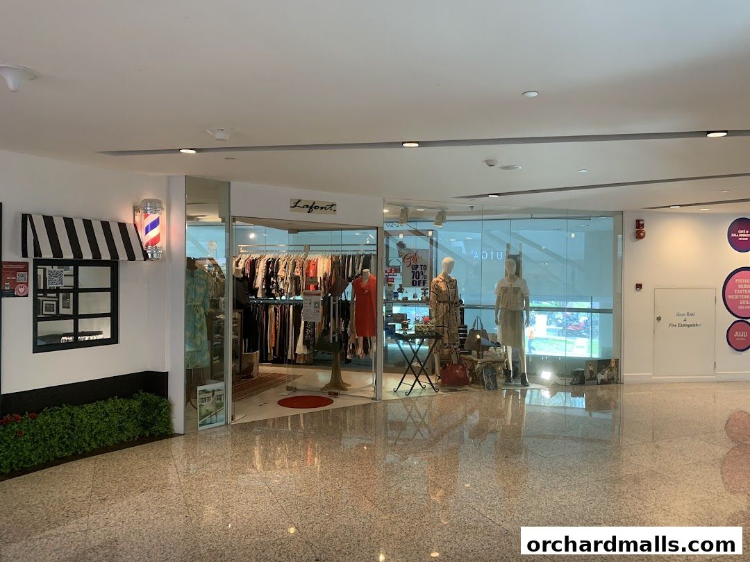 The Lafont shop entrance displays clothing on racks and mannequins, with a sale sign visible.