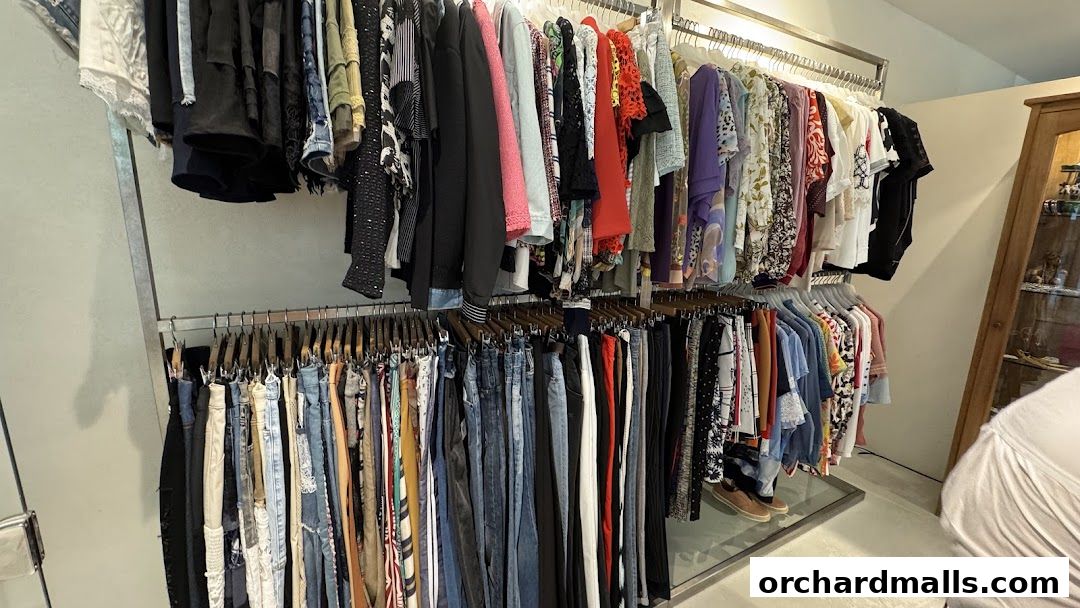 A wide selection of stylish clothing displayed on racks inside a boutique.