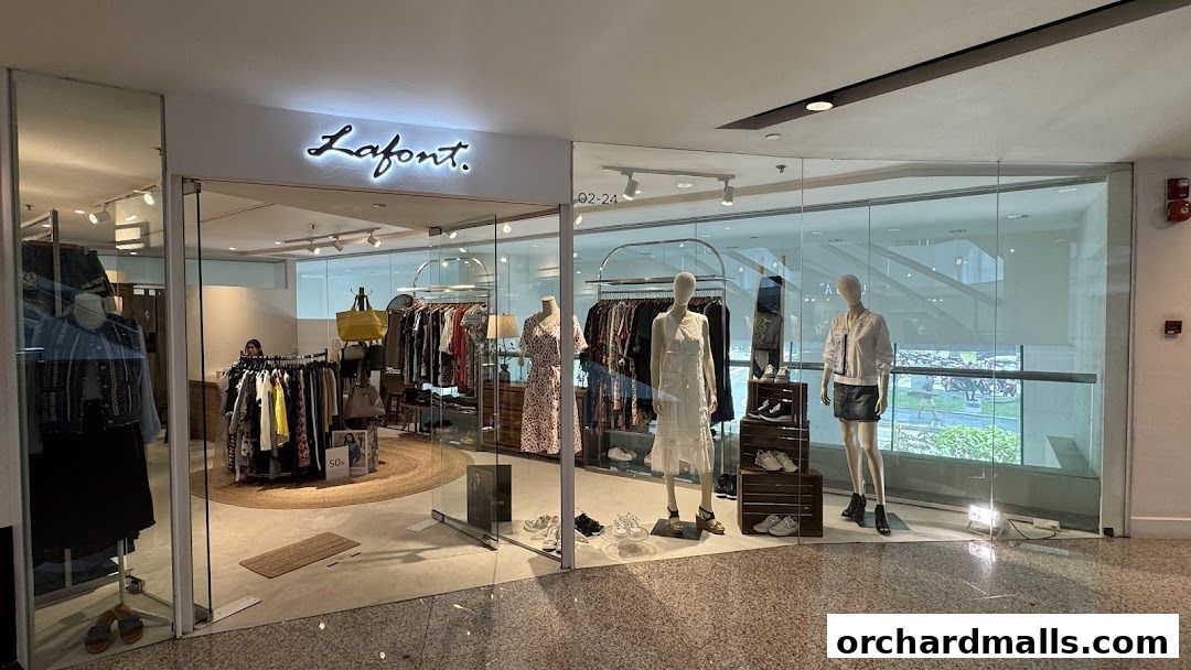 Lafont clothing store entrance with mannequins displaying outfits and racks of apparel.