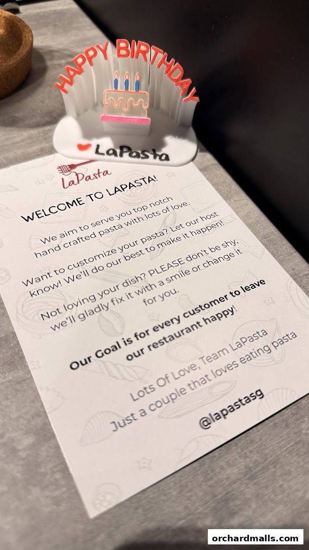 A welcome card and birthday decoration from LaPasta restaurant.