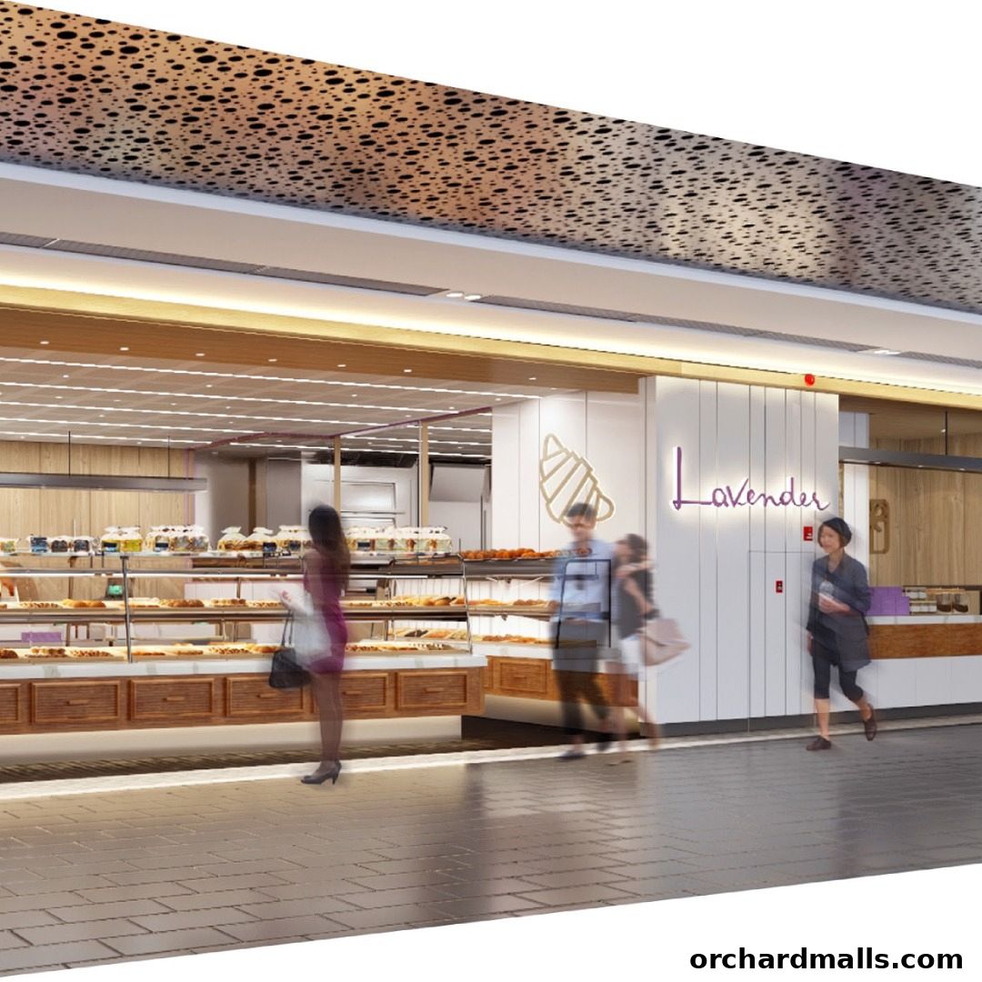 A bright and inviting bakery storefront with displays of pastries and people browsing.