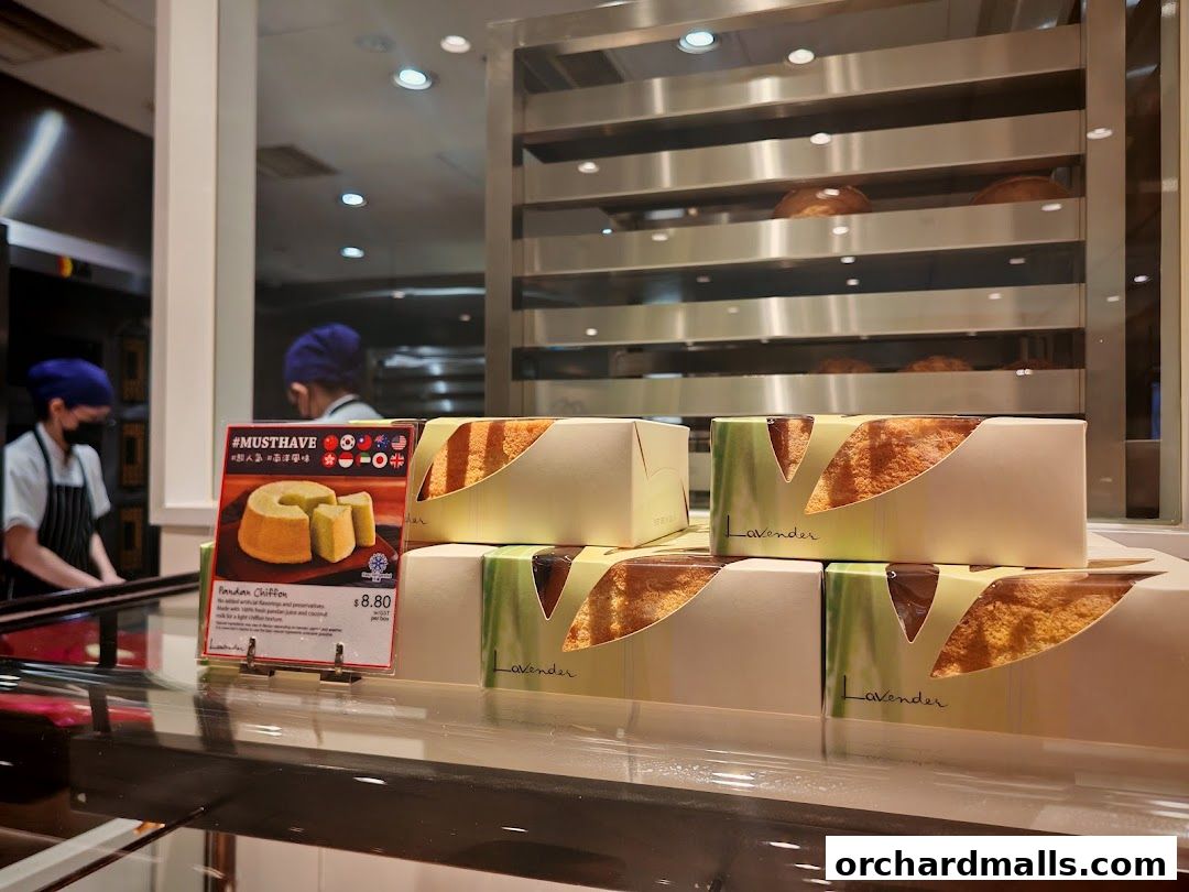 Pandan Chiffon cake displayed in packaging at Lavender Bakery with staff in the background.