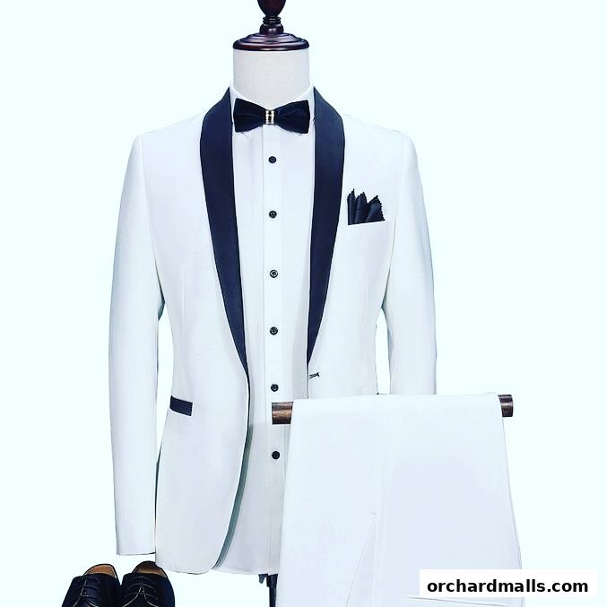 A white tuxedo with black lapels and a black bow tie on a mannequin.