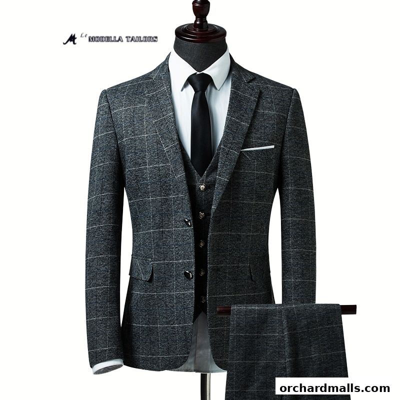 A tailored three-piece suit with a grey plaid pattern displayed on a mannequin.