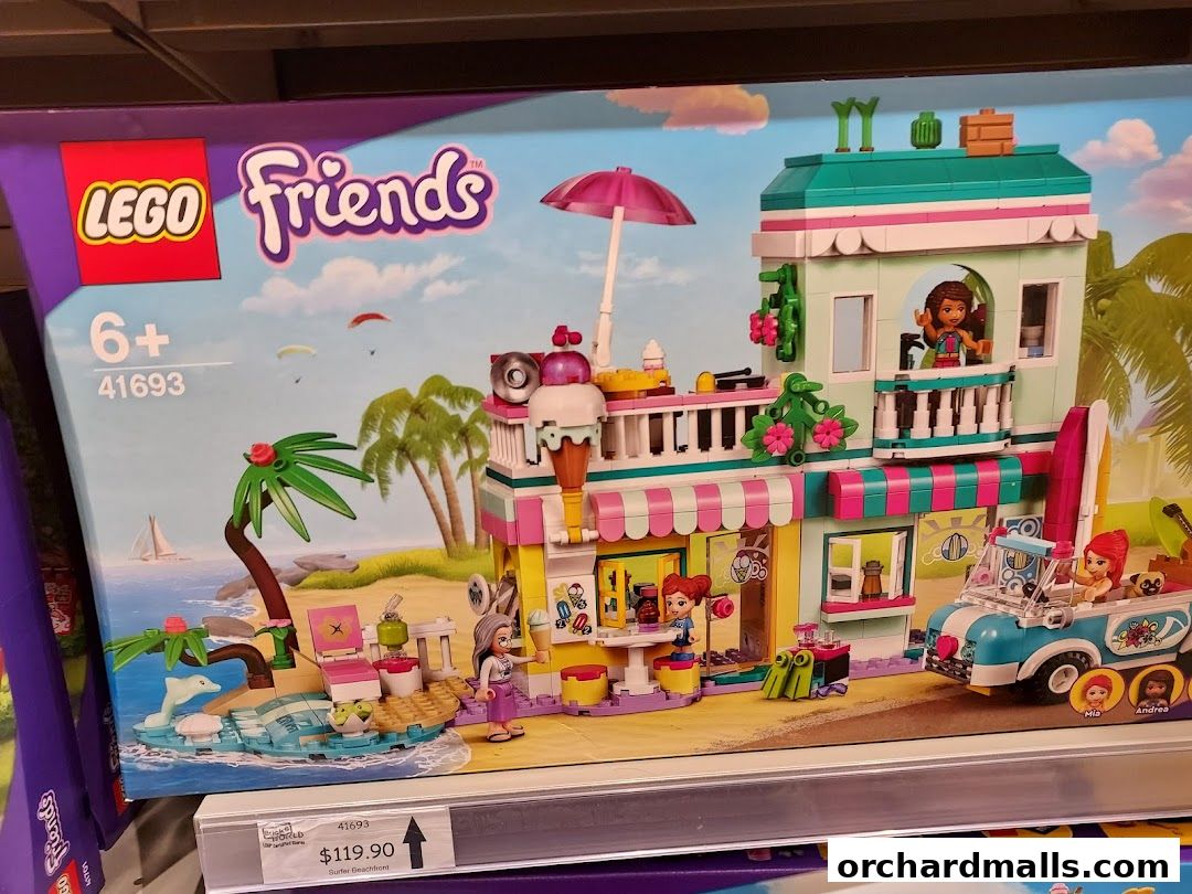 A LEGO Friends beach-themed building set with figures and accessories.
