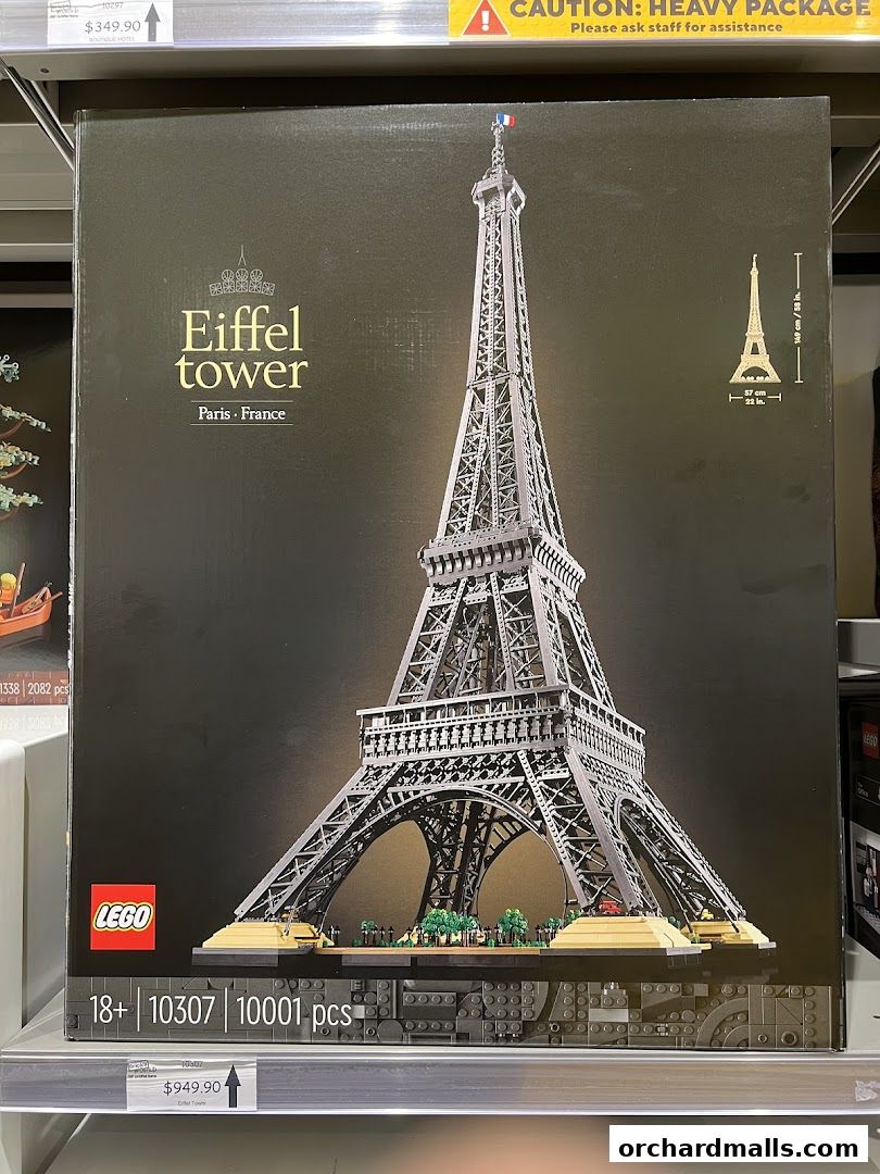 A large LEGO set box featuring the Eiffel Tower with product details and pricing.