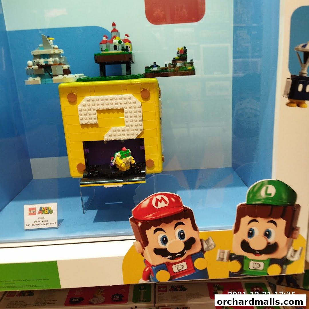 LEGO Super Mario 64 Question Mark Block display with Mario and Luigi figures.