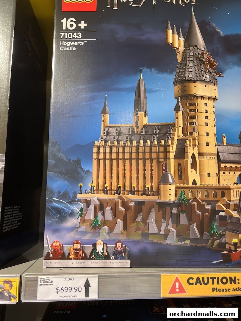 A LEGO Harry Potter Hogwarts Castle set with minifigures and price tag.