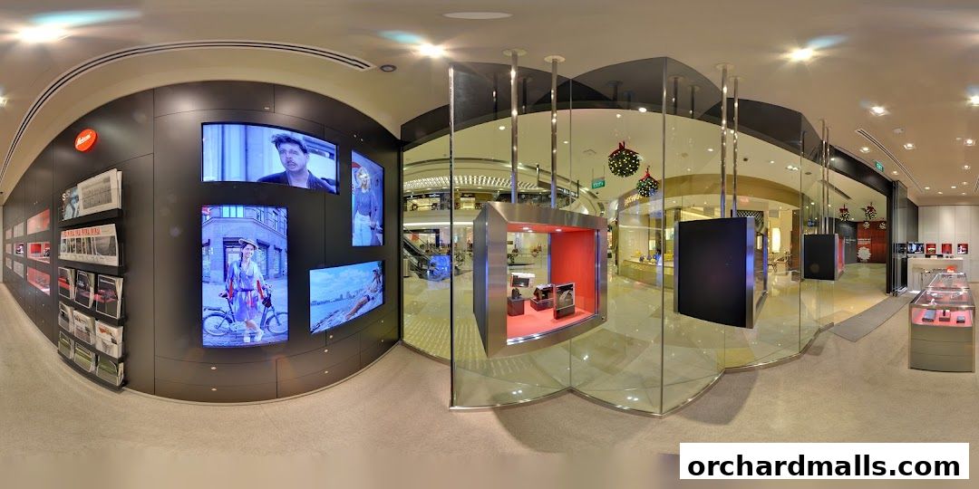 Interior view of a modern Leica store showcasing cameras and lifestyle products.