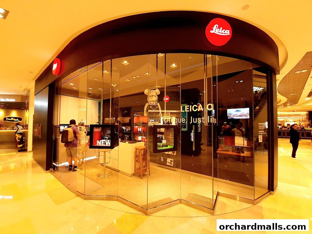 The Leica Store ION Orchard features a modern glass facade showcasing cameras and accessories.