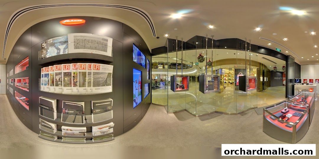 Interior view of a Leica Store showcasing cameras, accessories, and magazines.