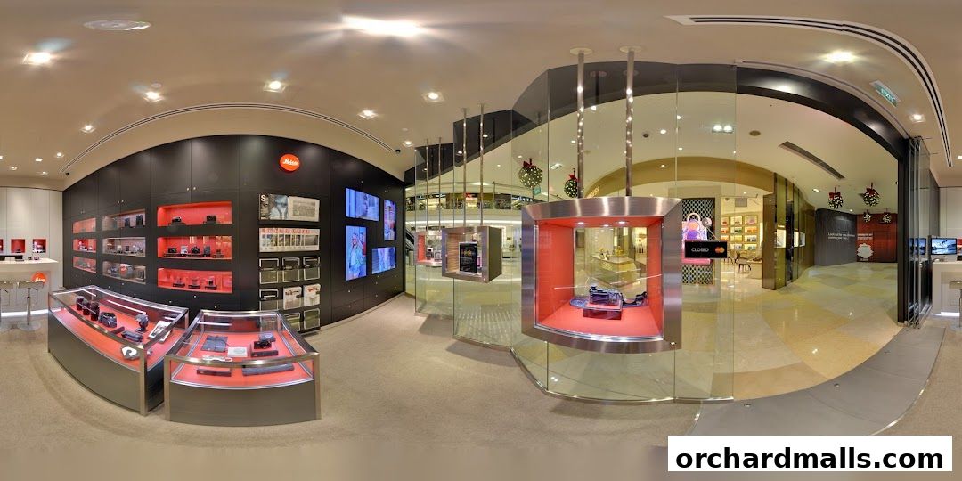Interior view of a Leica Store showcasing cameras and accessories in display cases.