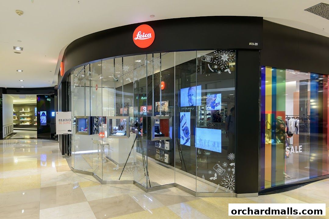 The Leica Store ION Orchard features a modern glass facade with displays of cameras and accessories.