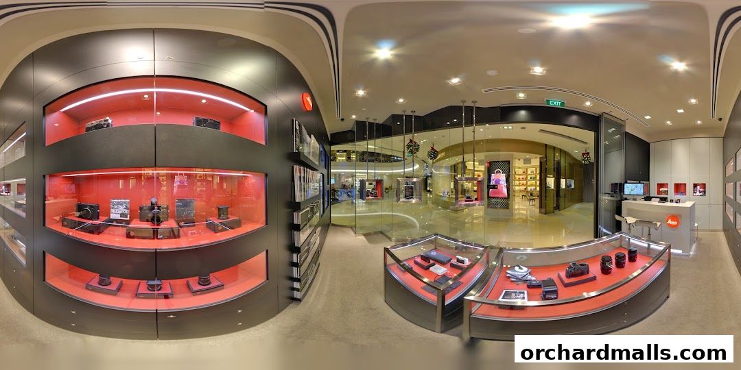 Interior view of a Leica store showcasing cameras and lenses in display cases.