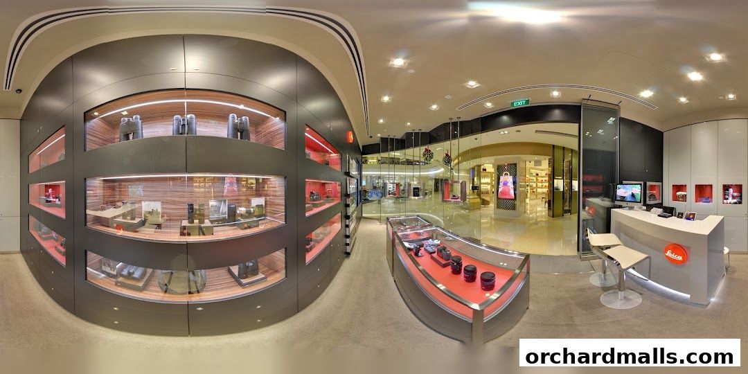 Interior view of a modern Leica store showcasing cameras and accessories in display cases.
