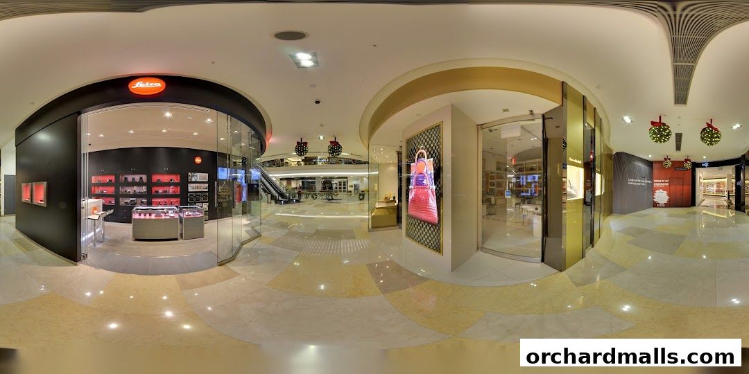 The Leica Store ION Orchard features a modern, well-lit interior with display cases showcasing products.