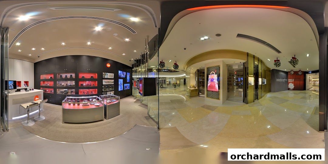 Interior view of a modern Leica camera store showcasing products and displays.