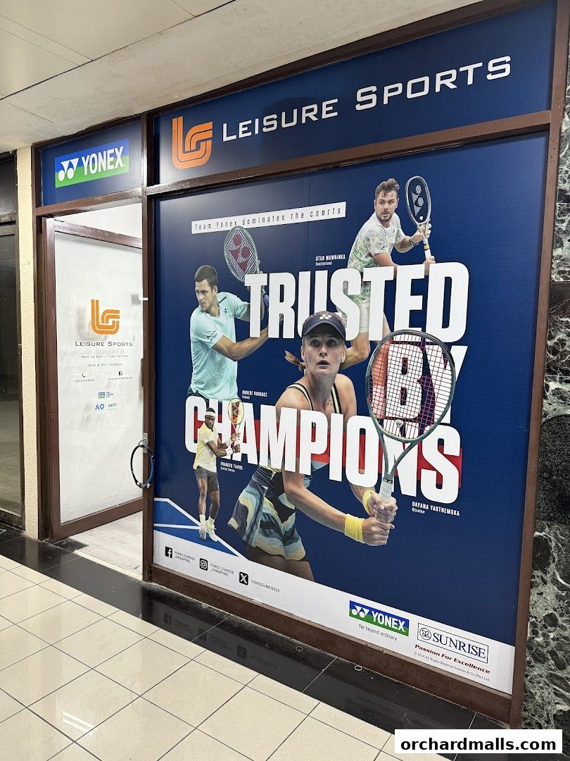 Leisure Sports shop front with a large advertisement featuring tennis champions and Yonex branding.