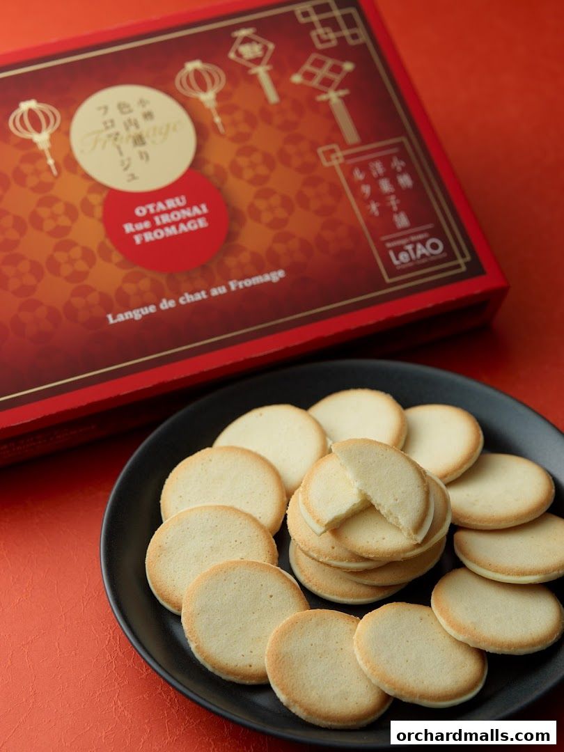 A box of LeTAO's Langue de chat au Fromage cookies with a plate of cookies.