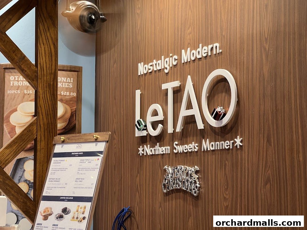 LeTAO shop interior with featured cakes menu and branding.
