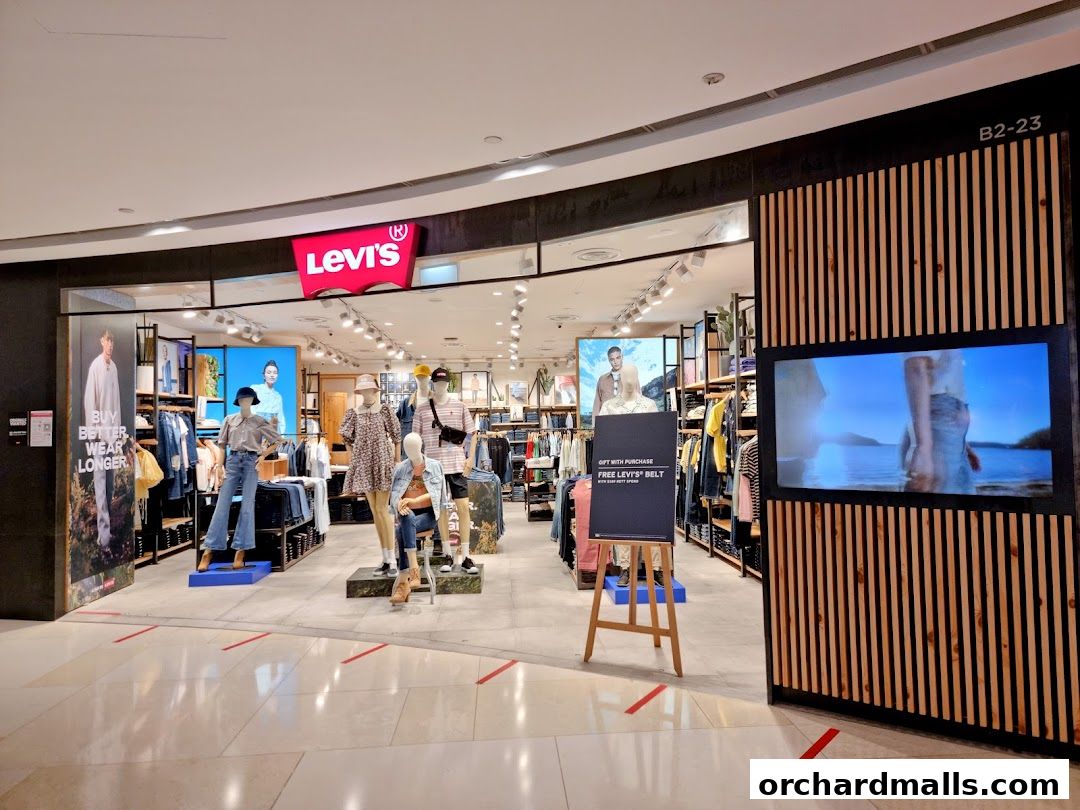 The entrance of a Levi's store with mannequins displaying clothing and promotional signage.