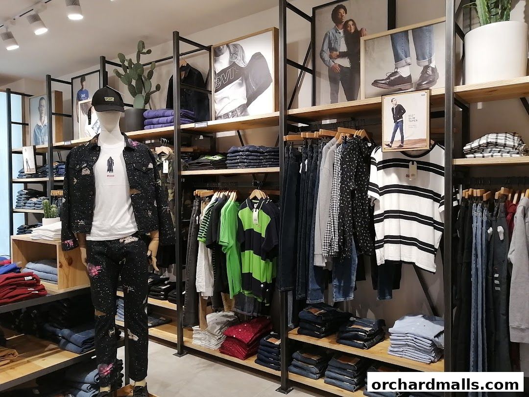 Interior of a Levi's store showcasing denim jeans, t-shirts, and a mannequin dressed in Levi's.