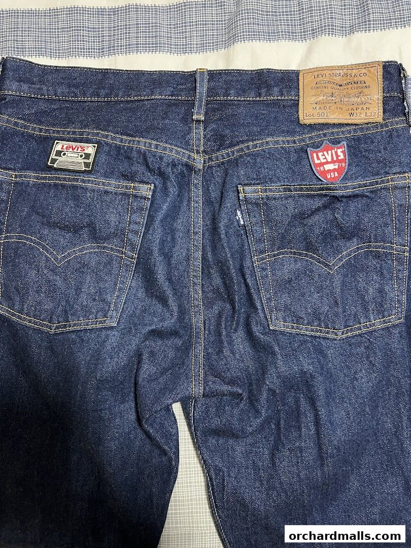 Close-up of the back of dark wash Levi's jeans with iconic branding and patches.