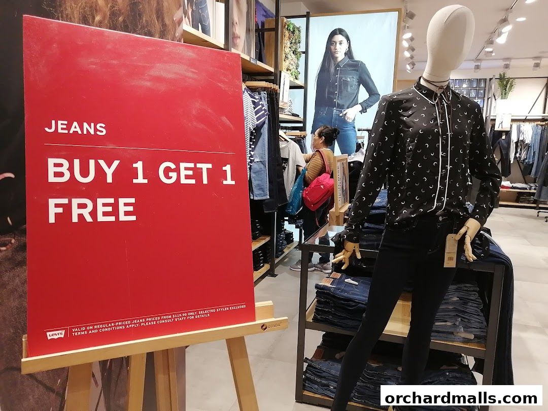 A Levi's store with a 'Buy 1 Get 1 Free' jeans promotion and a mannequin.