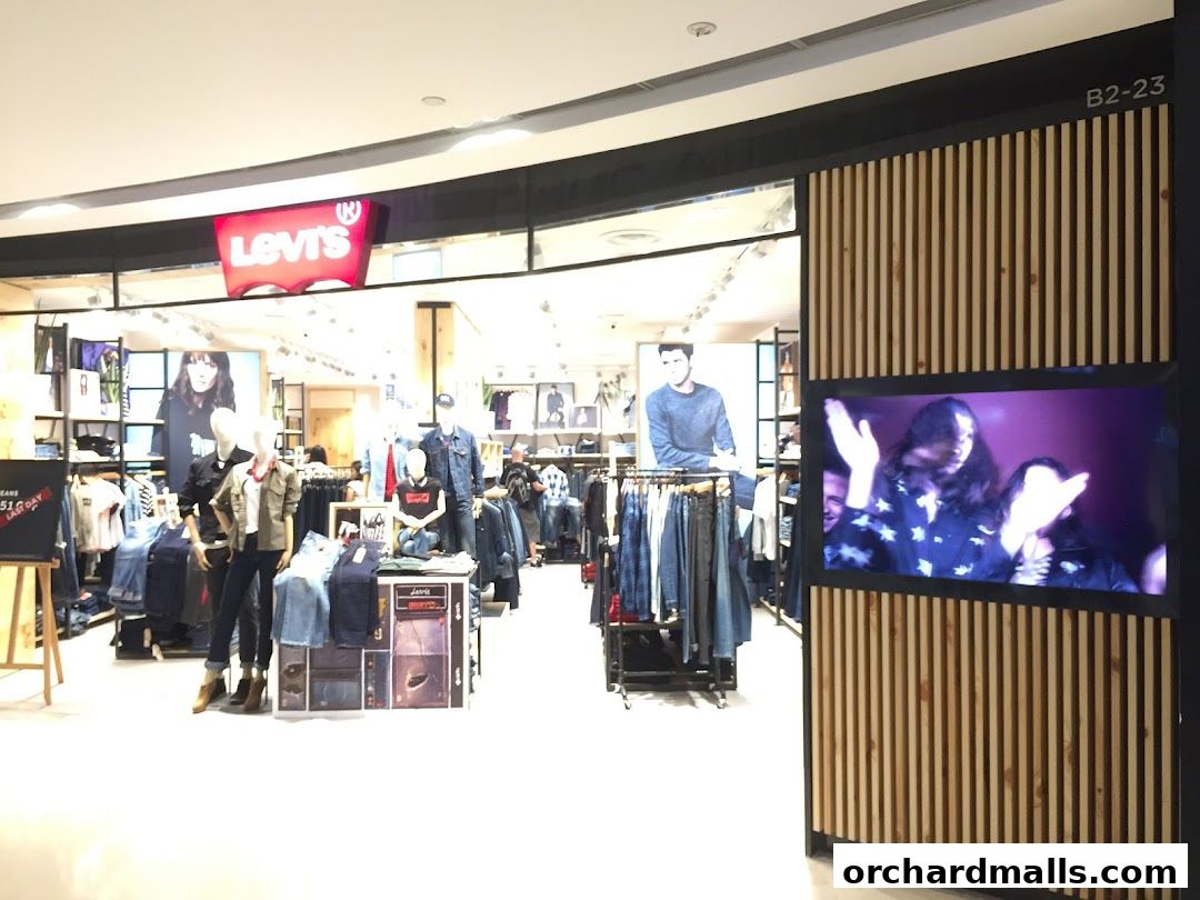 The entrance of a Levi's store with mannequins displaying jeans and apparel.