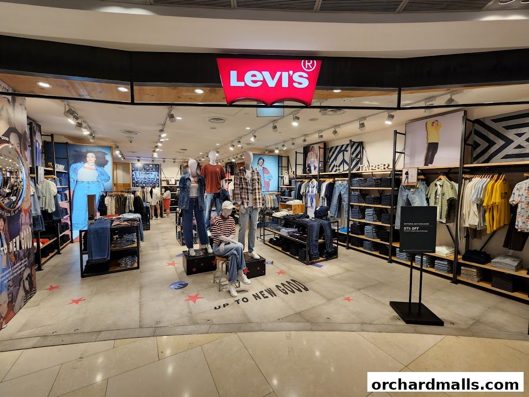 The interior of a Levi's store showcasing denim jeans, apparel, and mannequins.