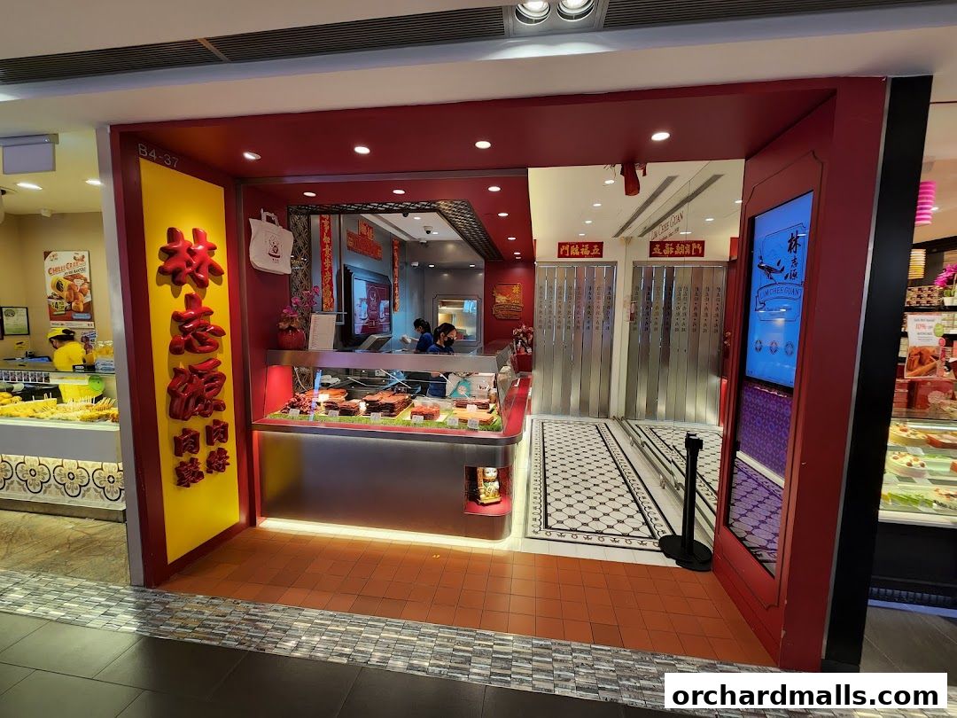 The entrance of Lim Chee Guan, a shop selling meat products, with a display of goods and signage.