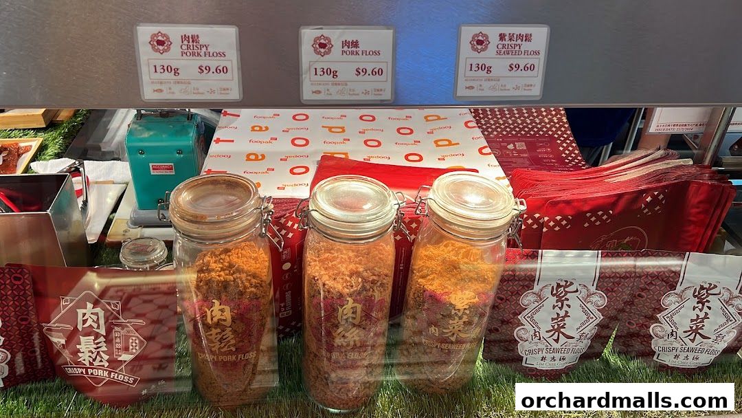 Display of crispy pork floss and crispy seaweed floss in jars and packaging.