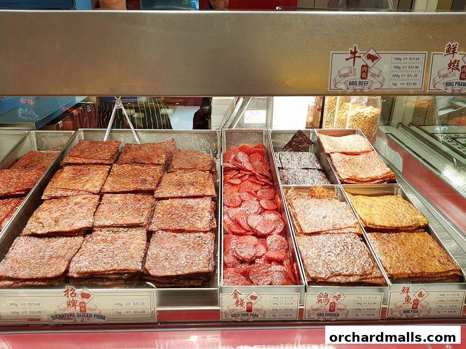 A display of various types of dried meat snacks, including pork, beef, chicken, and fish.