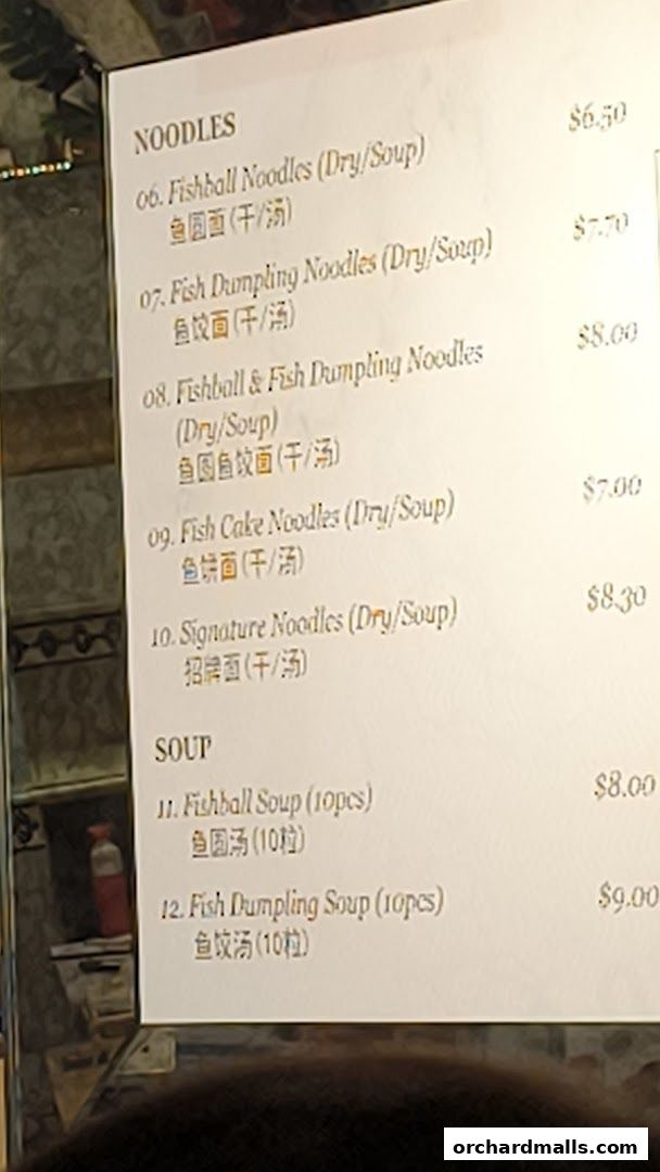 A menu featuring various noodle and soup dishes with prices.
