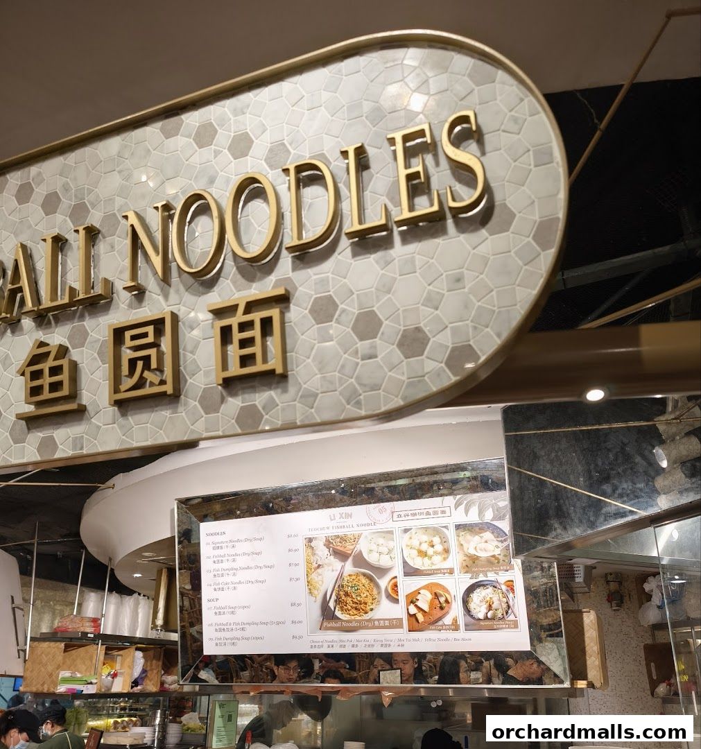 A menu board for Li Xin Teochew Fishball Noodles with various noodle and soup options.