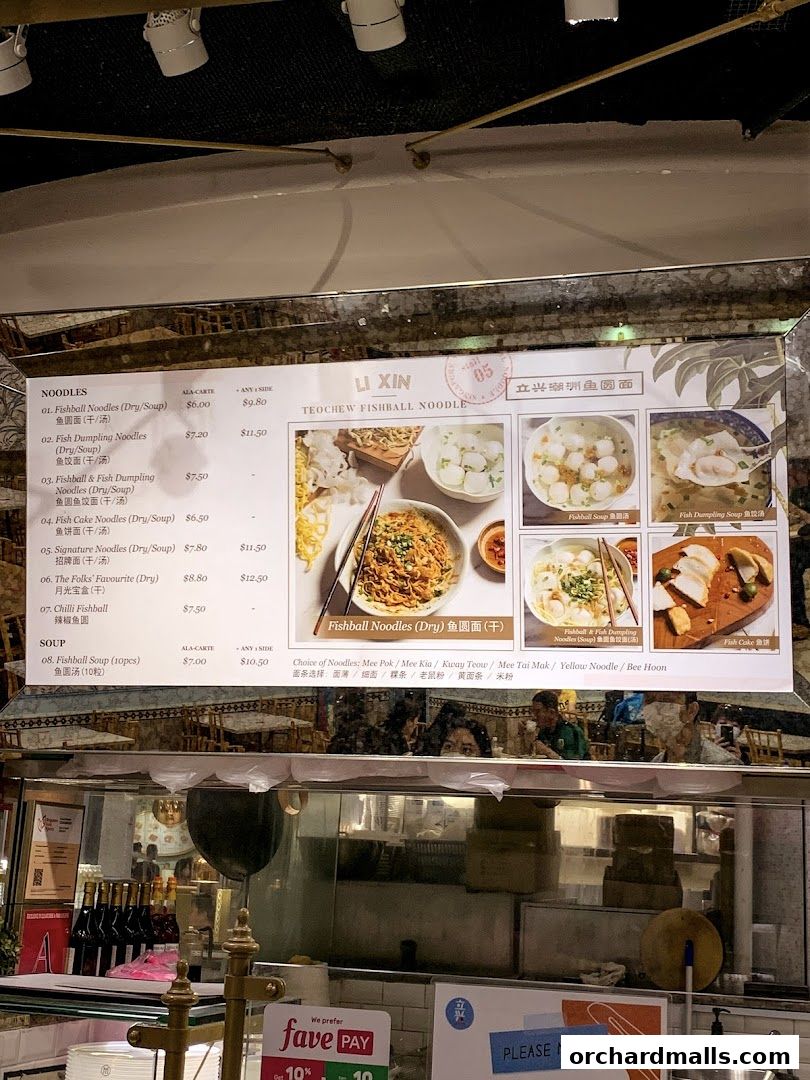 A menu board for Li Xin Teochew Fishball Noodles with various noodle and soup options.