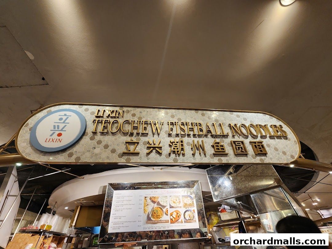 A sign for LiXin Teochew Fishball Noodles with a menu board below.