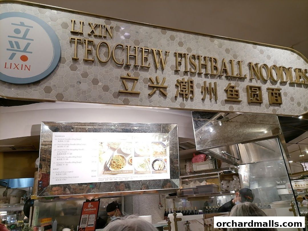 A menu board for LiXin Teochew Fishball Noodles with various noodle and soup options.